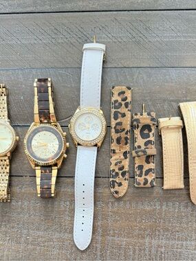 2 Michael Kor, white leather is Guess